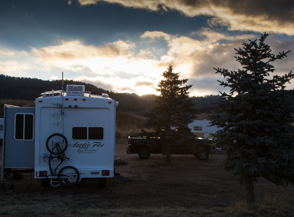 Sun setting on Arctic Fox fifth wheel while camping in Colorado